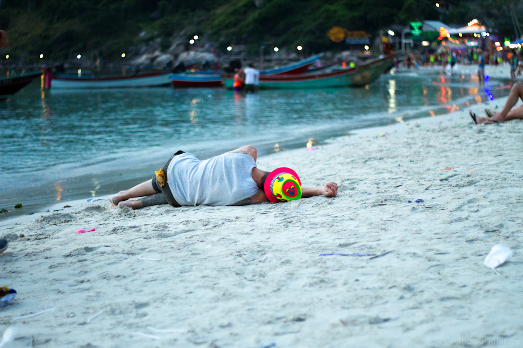 Full Moon Party 6 October 2014 Photo 19. Guy sleeping on Haad Rin beach